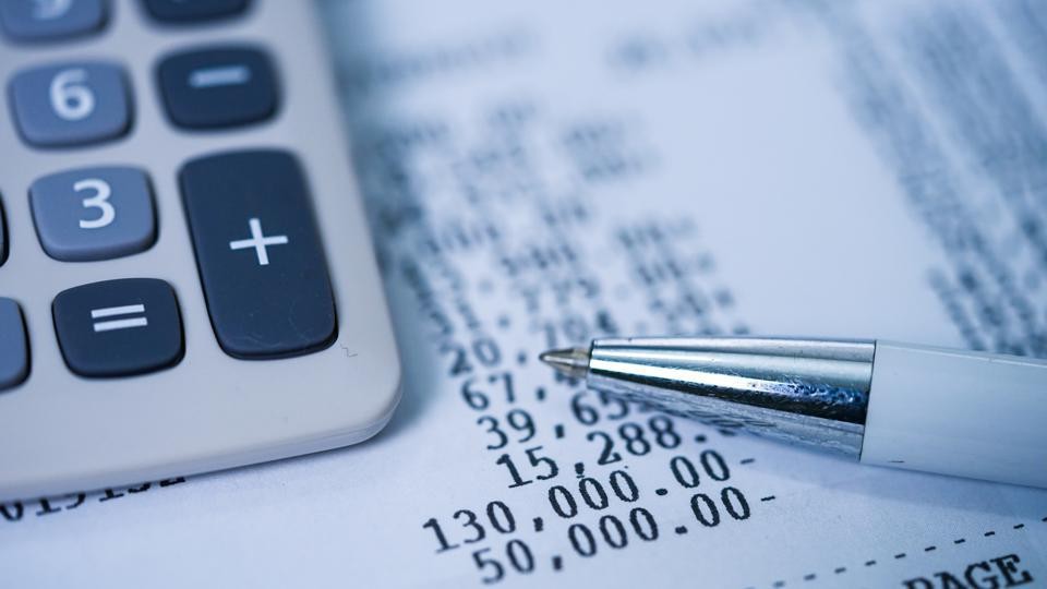 Financial papers and a calculator. 