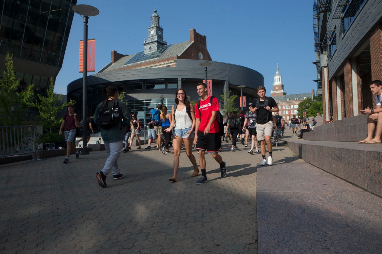 A photo UC students walking down the campus Main Street