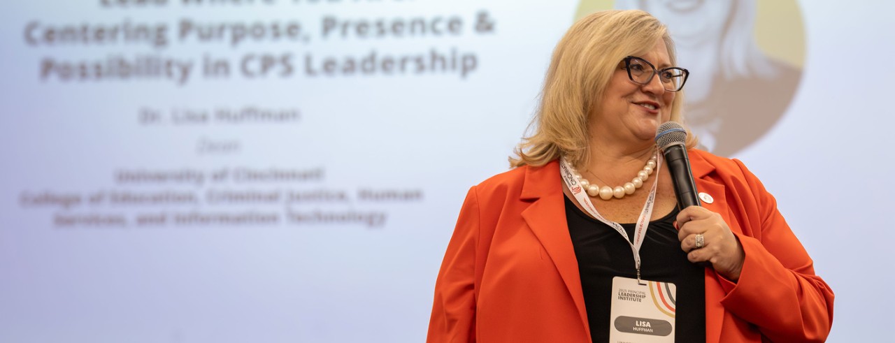 Lisa Huffman speaks at an event for public school principals