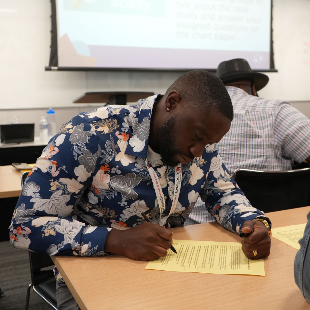 Man works on a worksheet