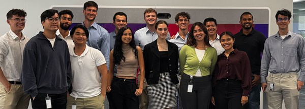 Group of Royal Caribbean interns posing for a photo in an office setting.