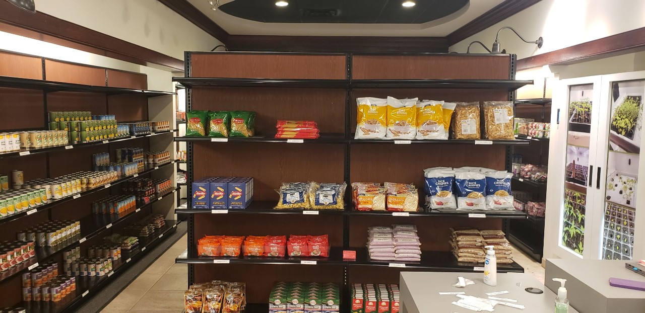 Stocked shelves in a full student food pantry