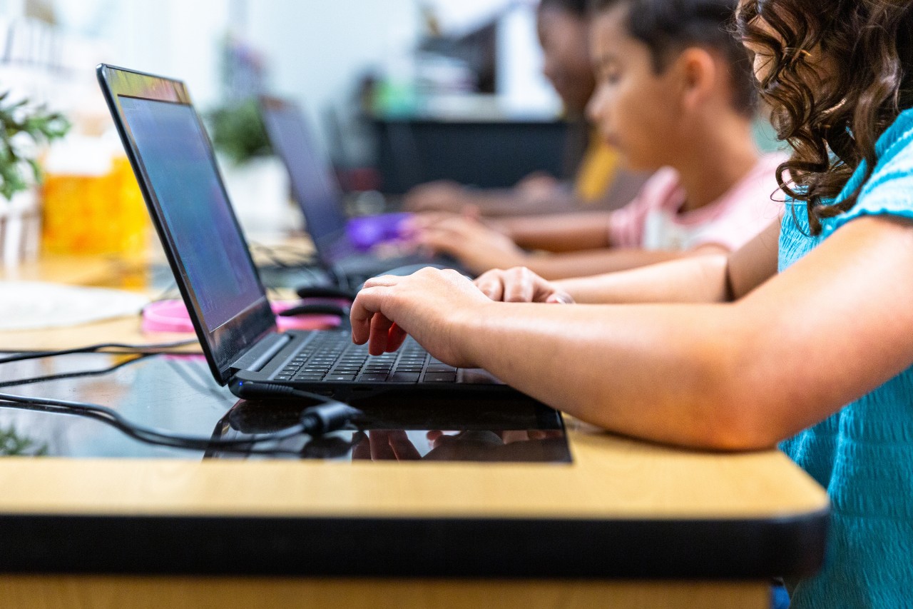 Kids using laptops in the classroom. 