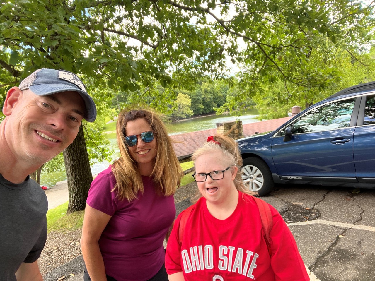 Three smiling people