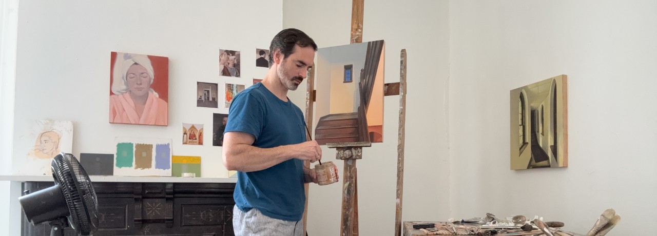 Emil Robinson painting in his studio. 