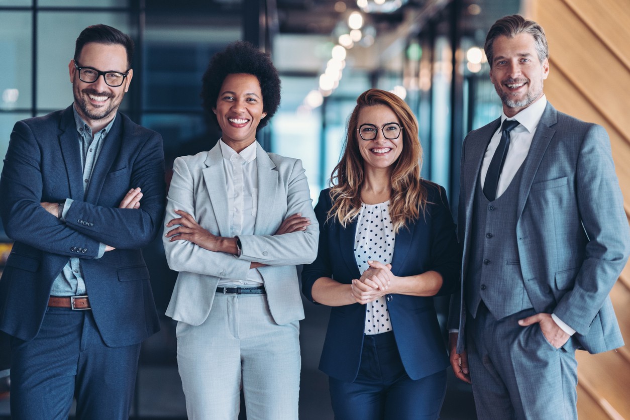 Young business professionals standing in doorway