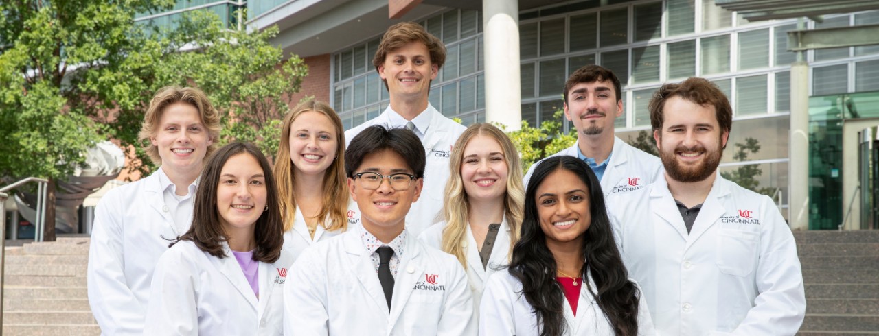 Ten medical students in front of Care Crawley building. 