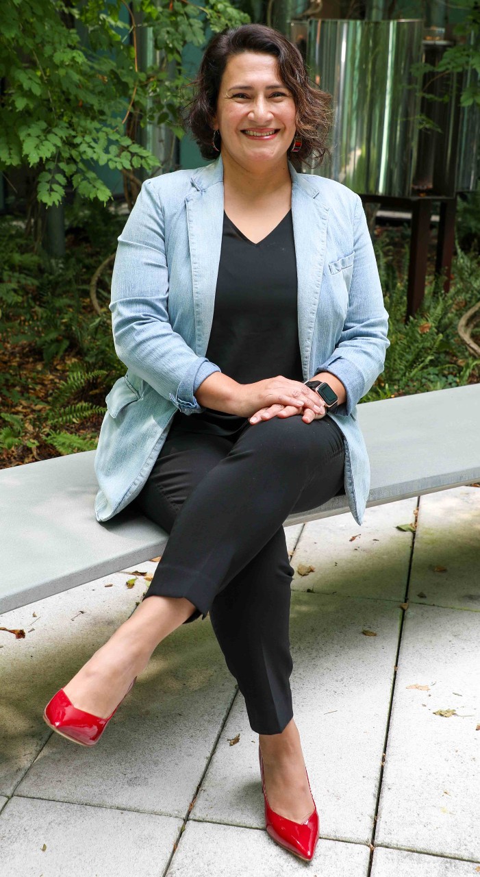 Photo of Georgette Angulo-Ramirez in a courtyard.