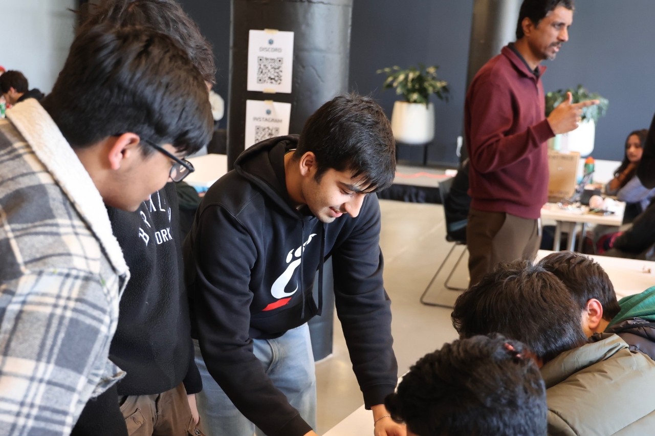 Students during the RevolutionUC hackathon at 1819. Photo/Daniel Vennemeyer