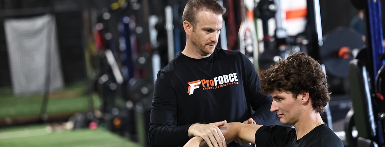 Kevin Hollabaugh trains an athlete at ProForce Sports Performance, his athletic training business he started in Milford, Ohio.