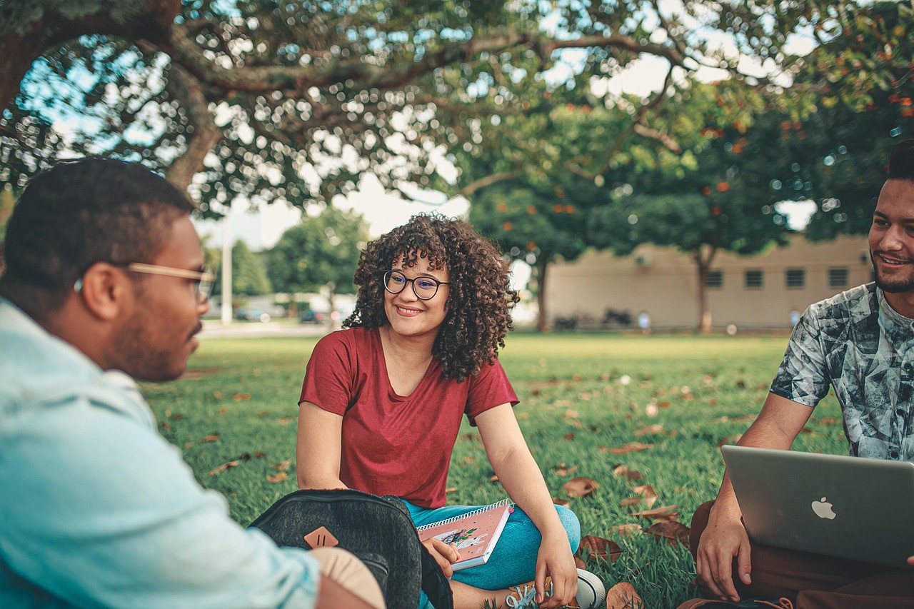 Students and instructor studying outdoors.