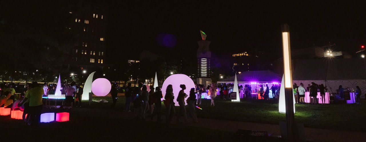 UC students on Campus Green at the University of Cincinnati enjoy a massive glow party for first-year students
