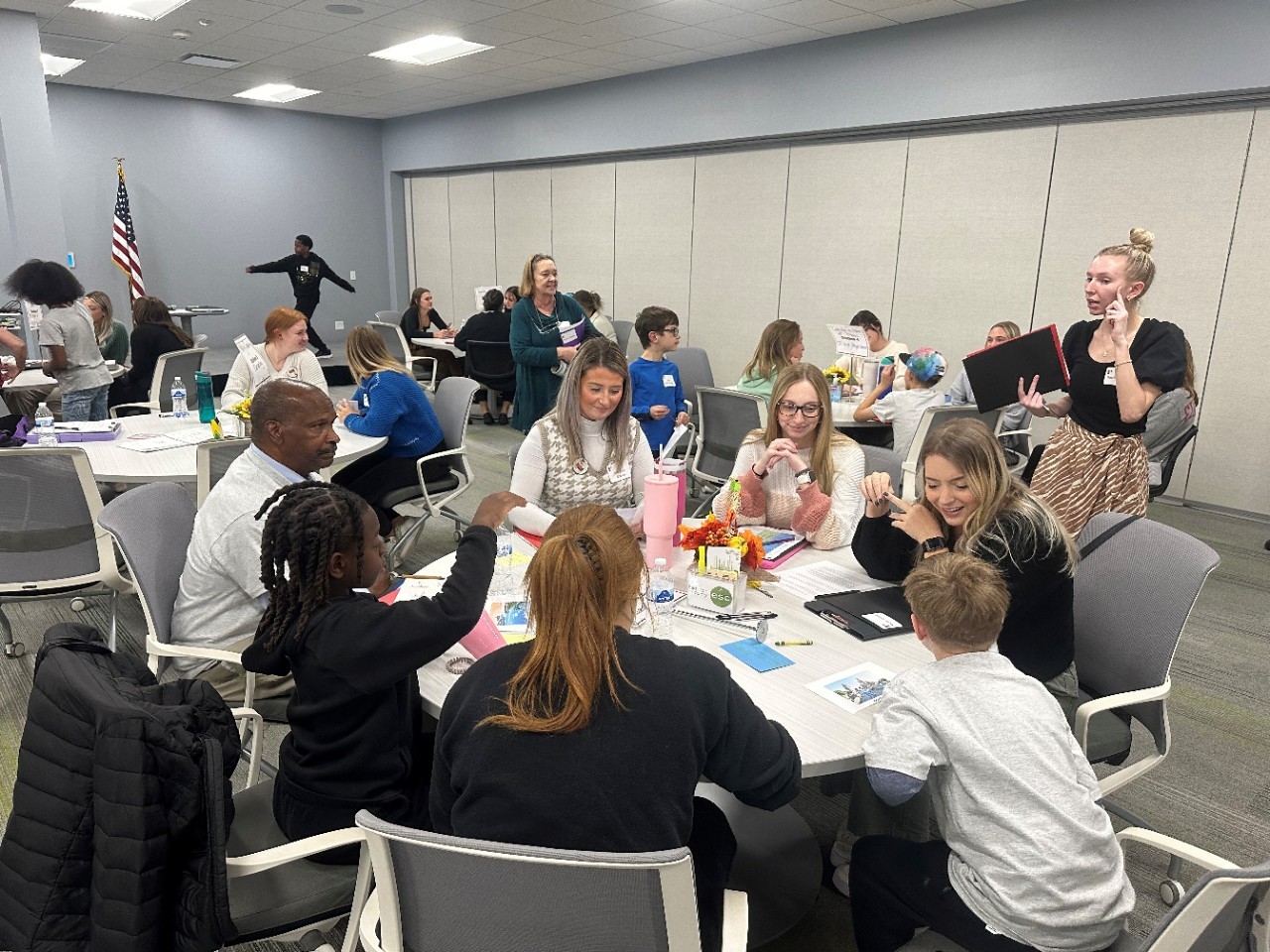 Speech-language pathology graduate students take part in a conversation station with children as part of Fluency Friday