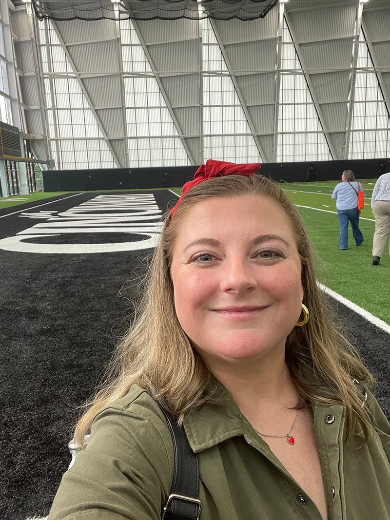 Jac Kern poses inside the Sheakley Indoor Practice Facility and Athletics Performance Center on the campus of University of Cincinnati