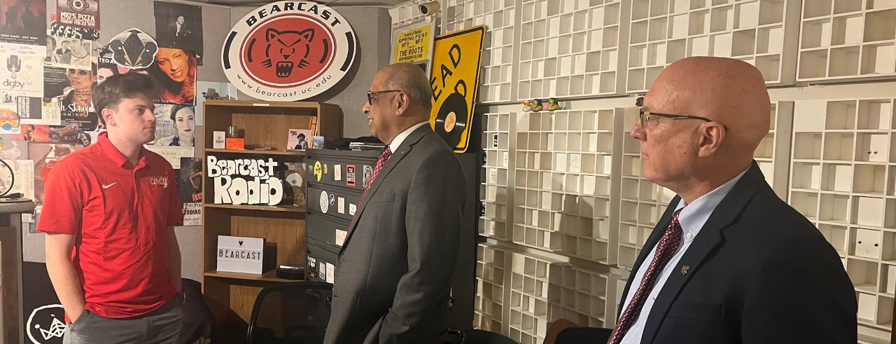 Hayden Ducker with UC President Neville Pinto and Interim Provost John Weidner inside Bearcast Media Studios