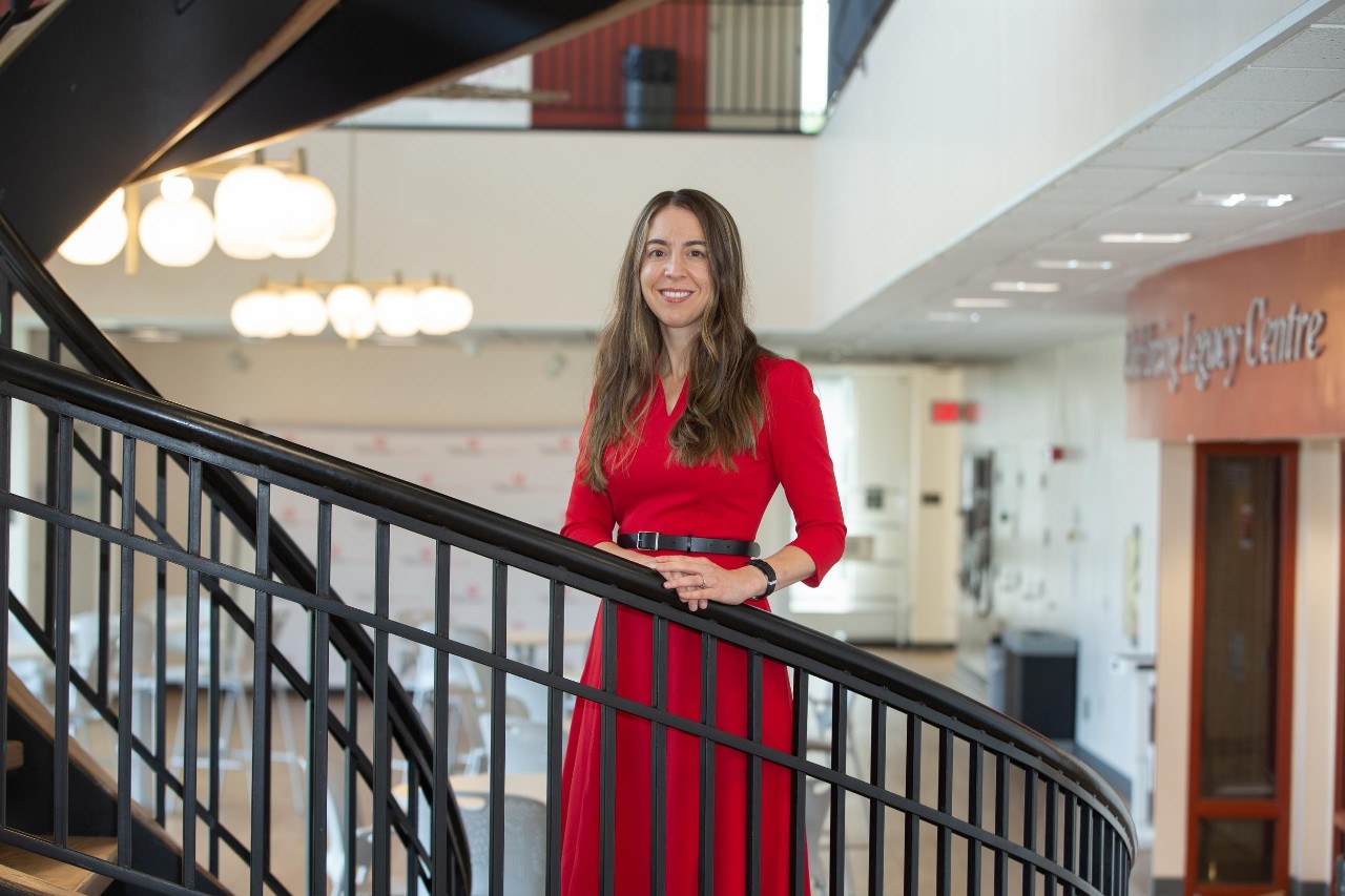 Randi Bates standing on a stairwell in UC College of Nursing