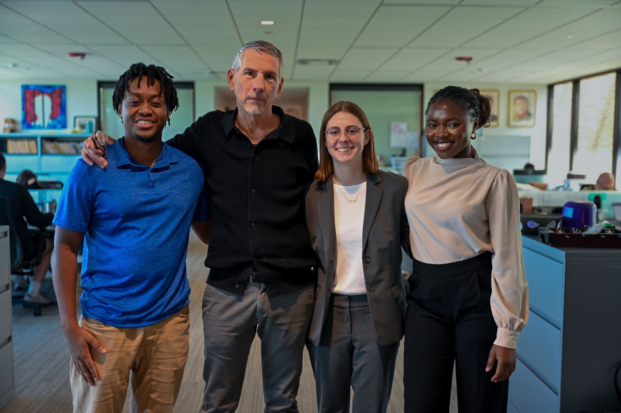 Four people shown in a UC Law room. They are Kofi Agyepong, Pierce Reed, Caroline Waller and Adesewa Adeyefa