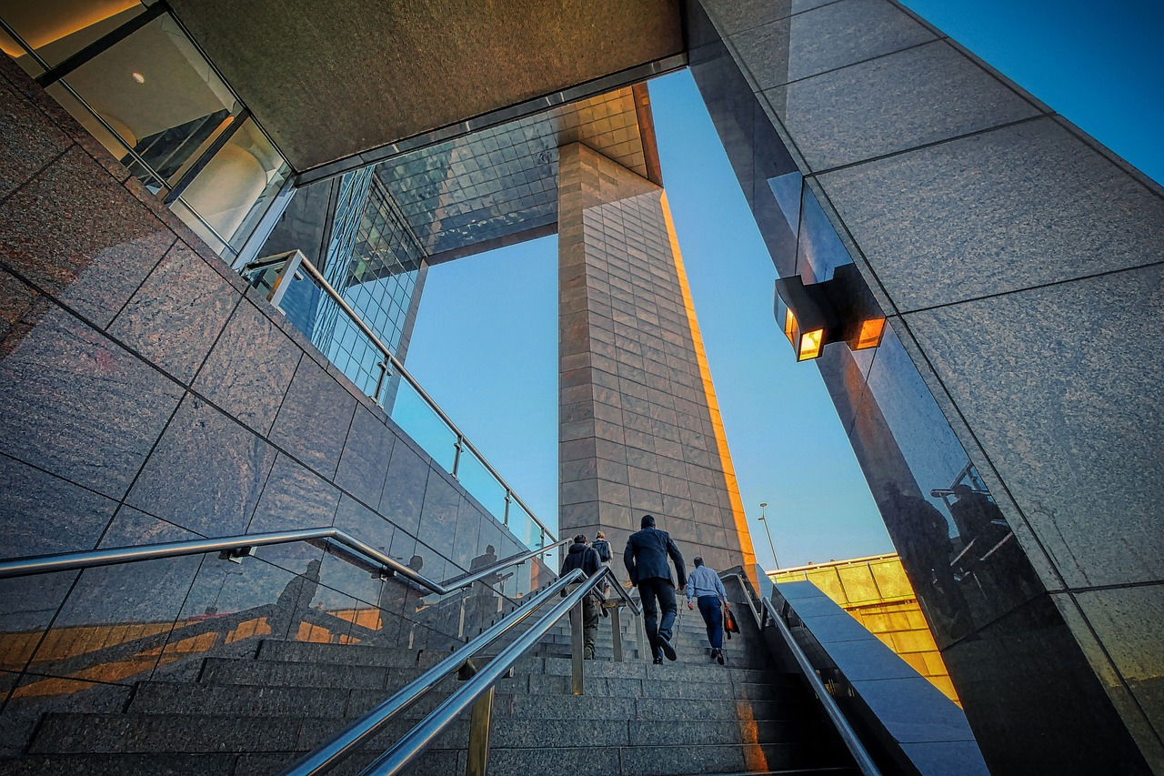 Photo of people walking up stairs.