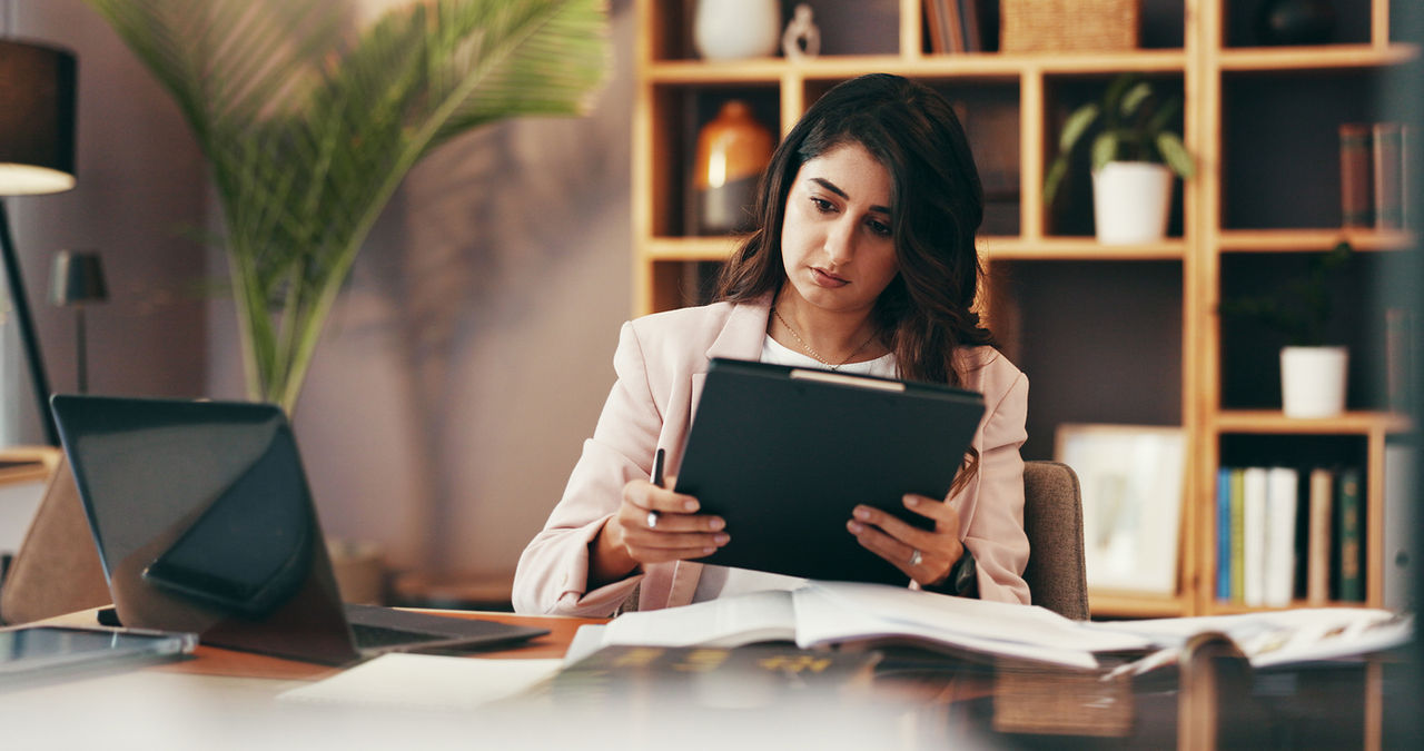 Woman, reading and tablet in office for business, legal research and communication. Lawyer, technology and consultant in law firm for case study, planning agenda and article report for information