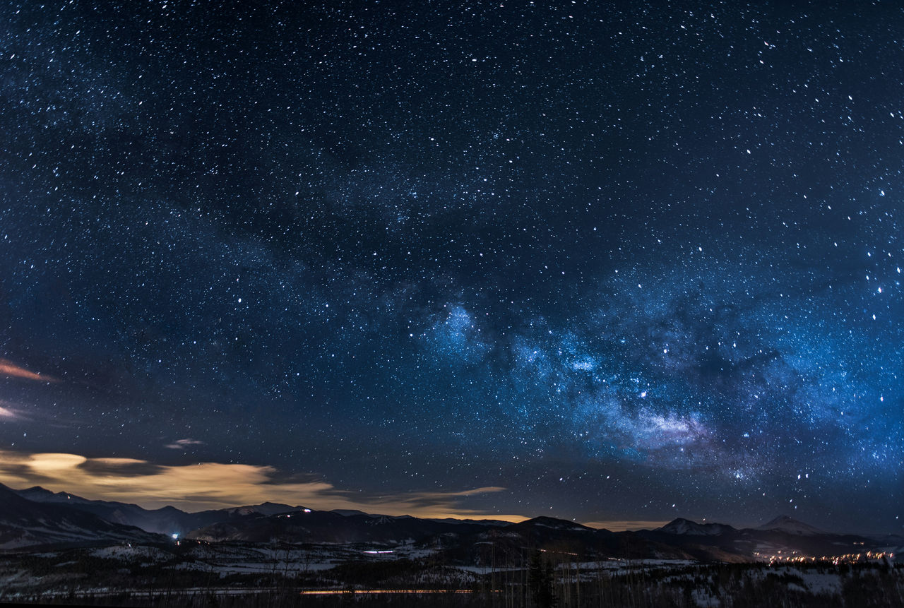 Night sky with city below.