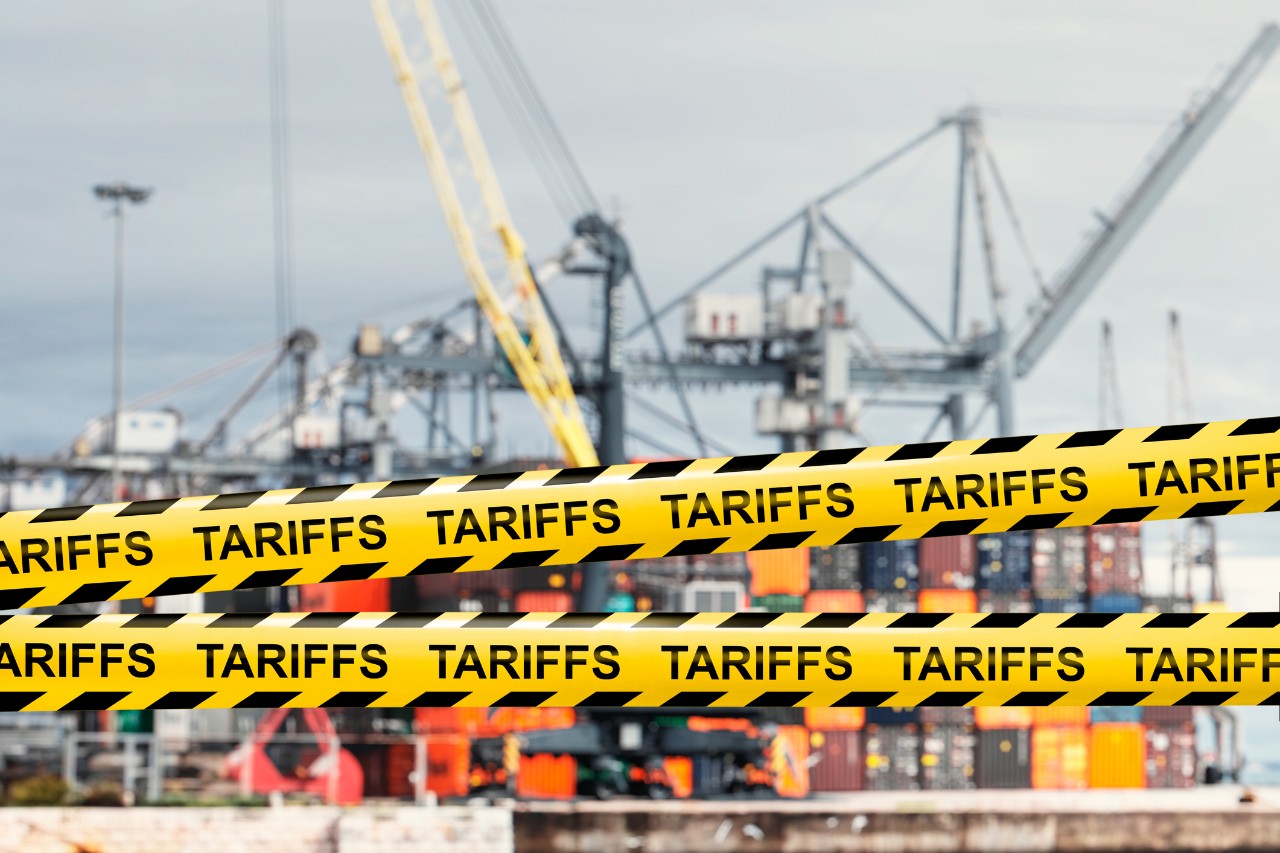 Tariff tape over shipping containers.