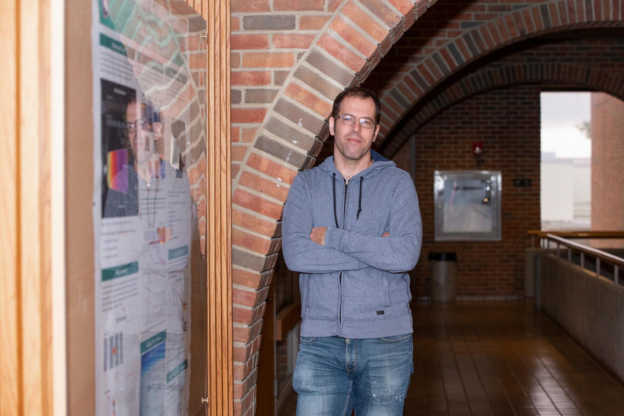 Portrait of Jure Zupan in front of a decorative brick arch in the Department of Physics.