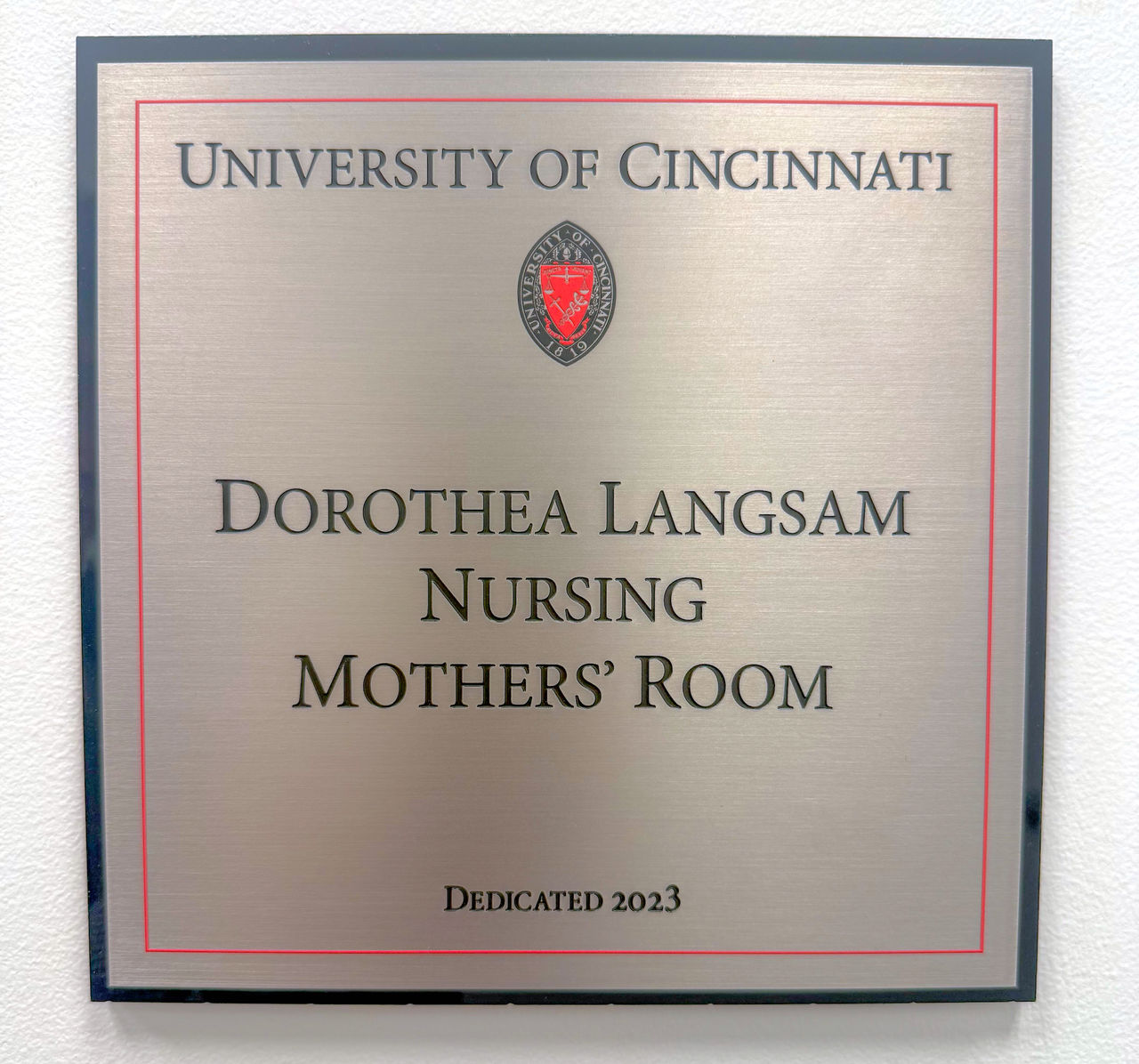 Bronze plaques with words, "University of Cincinnati, Dorthea Langsam Nursing Mothers' Room, Dedicated 2023."