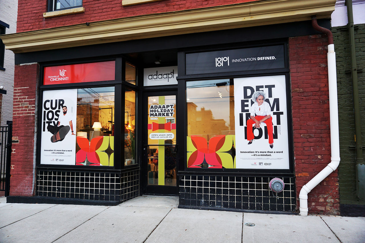 ADAAPT storefront at Findlay Market advertising a Dec. 2025 holiday pop up 