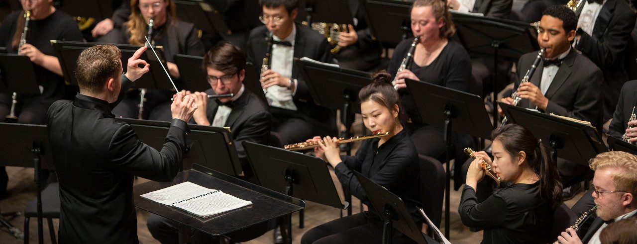 CCM Wind Symphony performs on stage