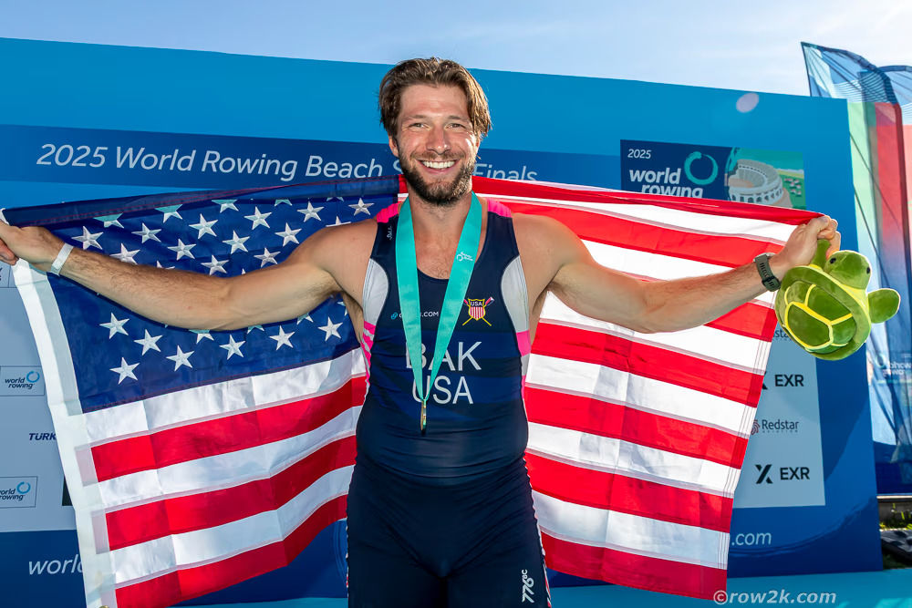 Bak poses with an American flag.