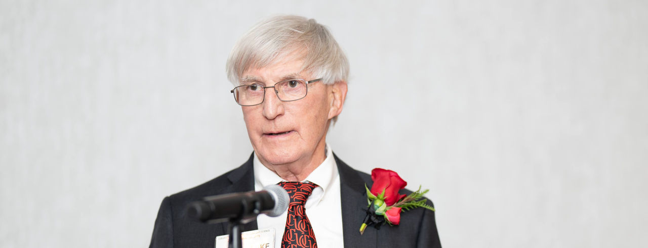 Mike Bowman speaking at podium