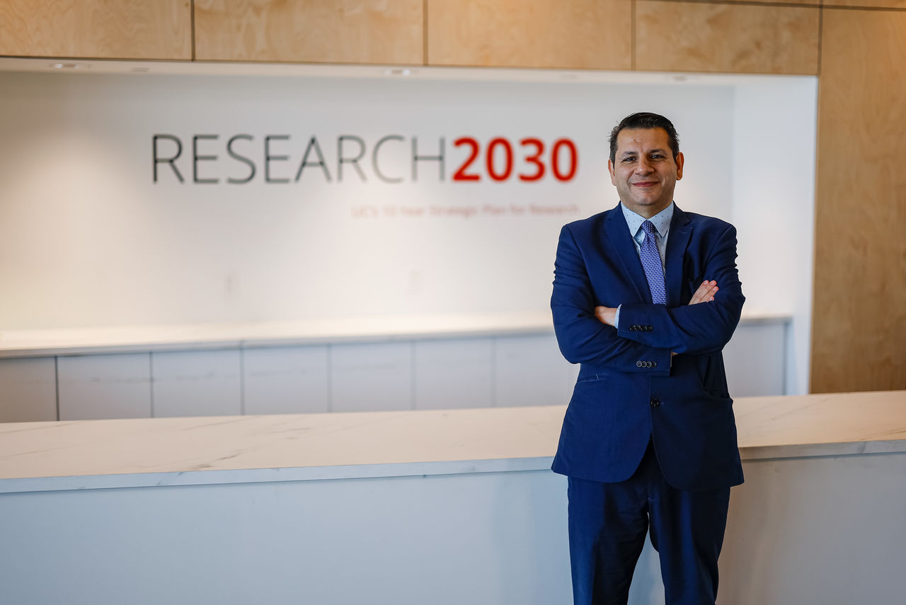 Munir Nazzal stands in front of a Research2030 sign at Digital Futures.