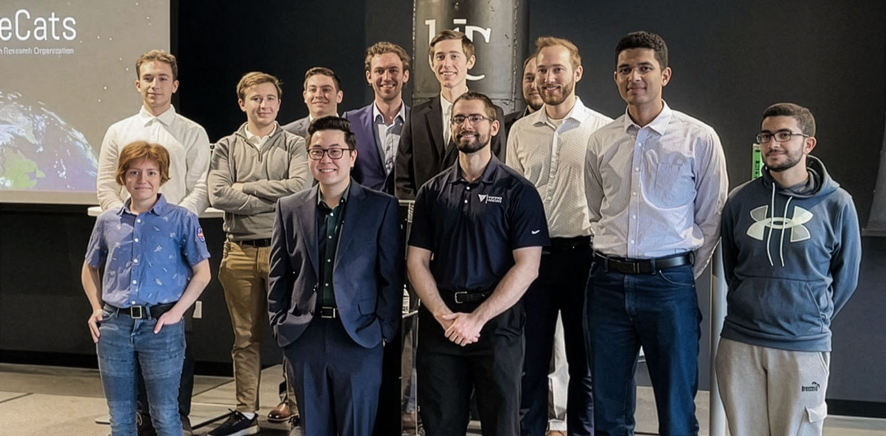 Generations of CubeCats stand together. 