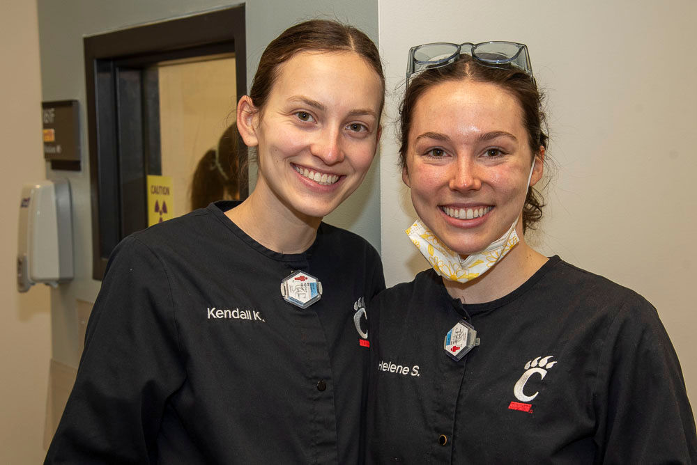 two smiling dental hygiene students