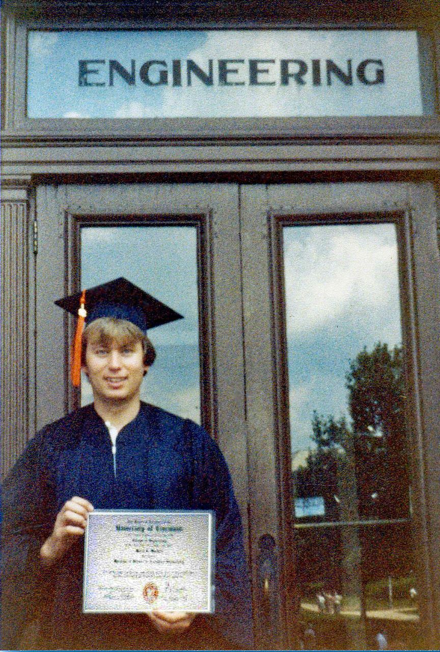 Barry Mitchell wearing commencement hat