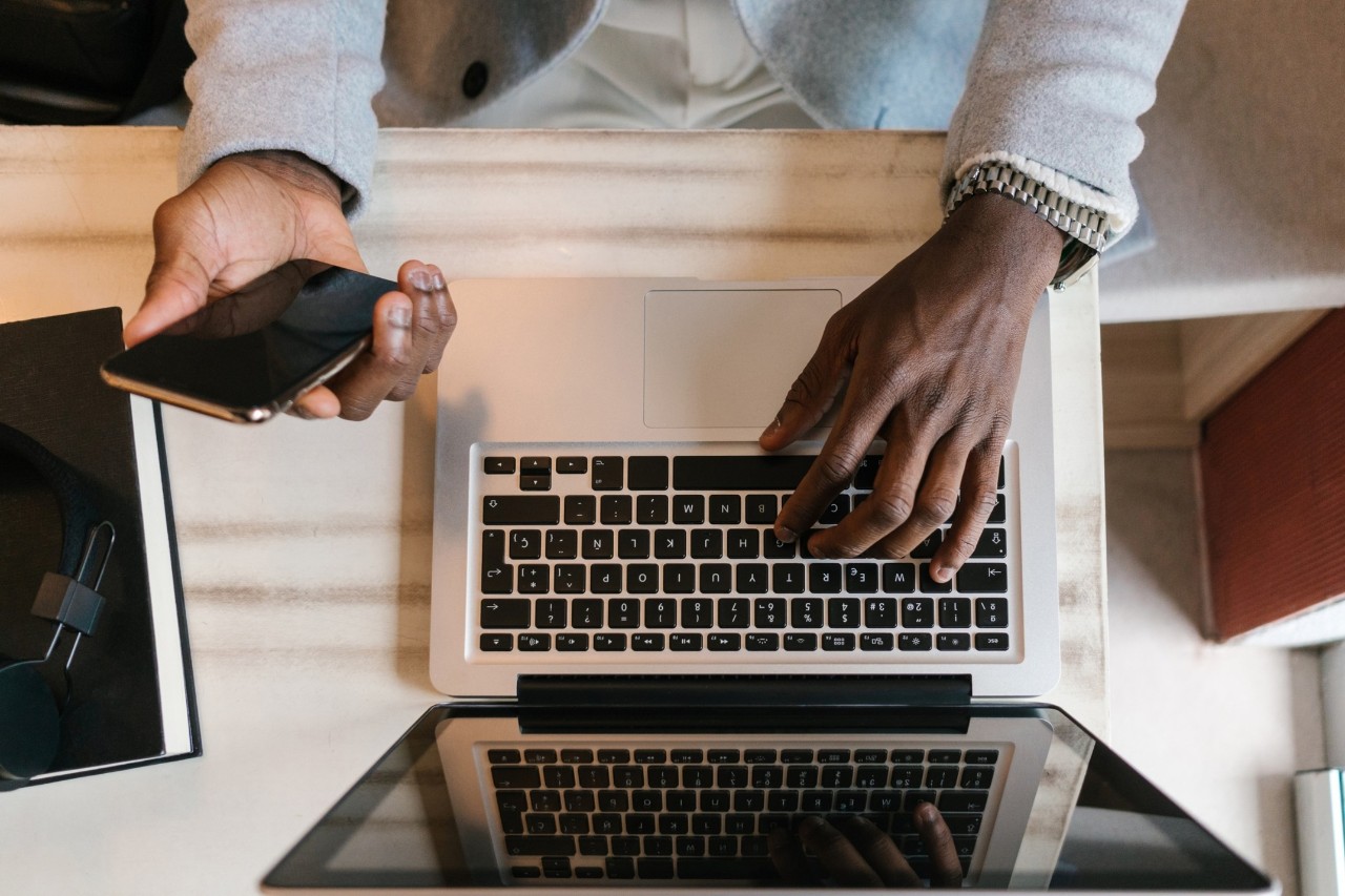 someone typing on a laptop computer