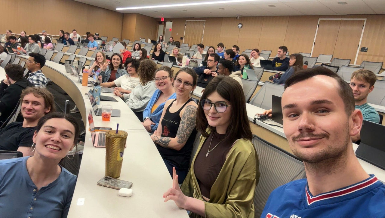 Second year law student Robby Belt sitting with friends in class