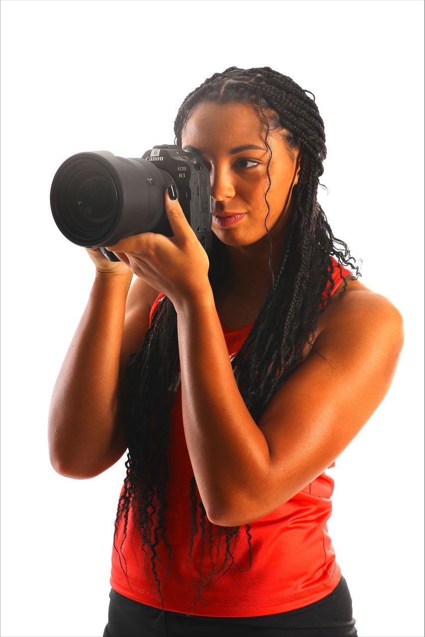 UC senior Mallory Mullen holds a camera while working as a sports photography intern with University of Cincinnati Athletics. Photo/Provided. 