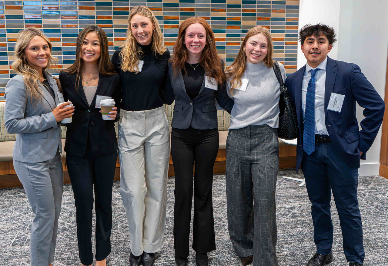 Lindner students in professional dress pose for a picture.