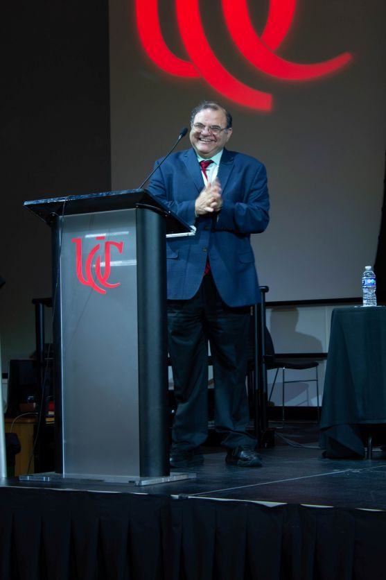 UC professor and the Brian H. Rowe Endowed Chair in Aerospace Engineering Dr. Kelly Cohen, Ph.D., introduces panelists participating in the afternoon keynote discussion, “From Cloud to Cognition—How AI is Reshaping the Future of Higher Education.”