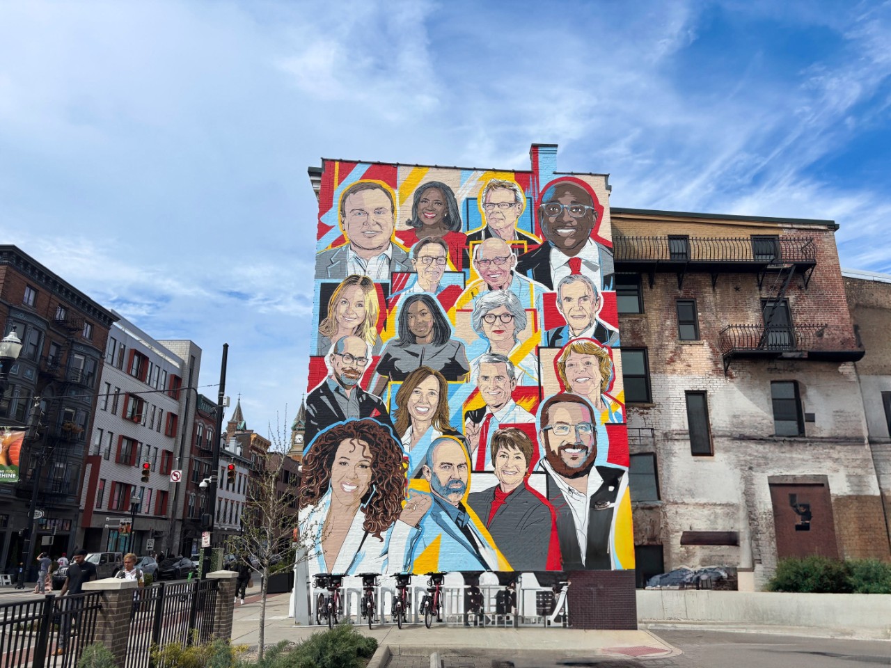 Cincinnati street art mural of UC alumni portraits