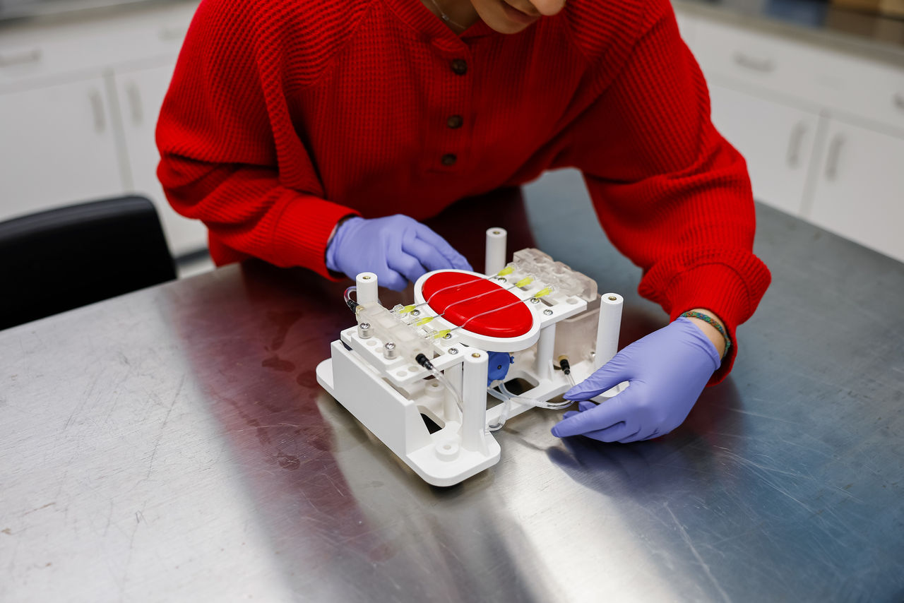 Hands of a UC co-op student using an instrument at Kaleidoscope Innovation