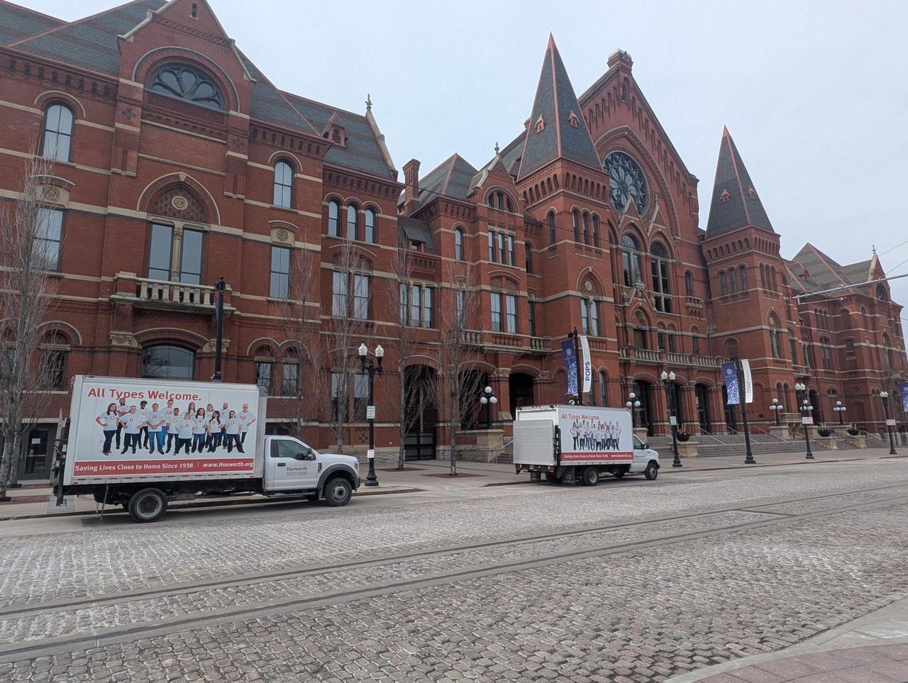 Hoxworth trucks parked outside Music Hall