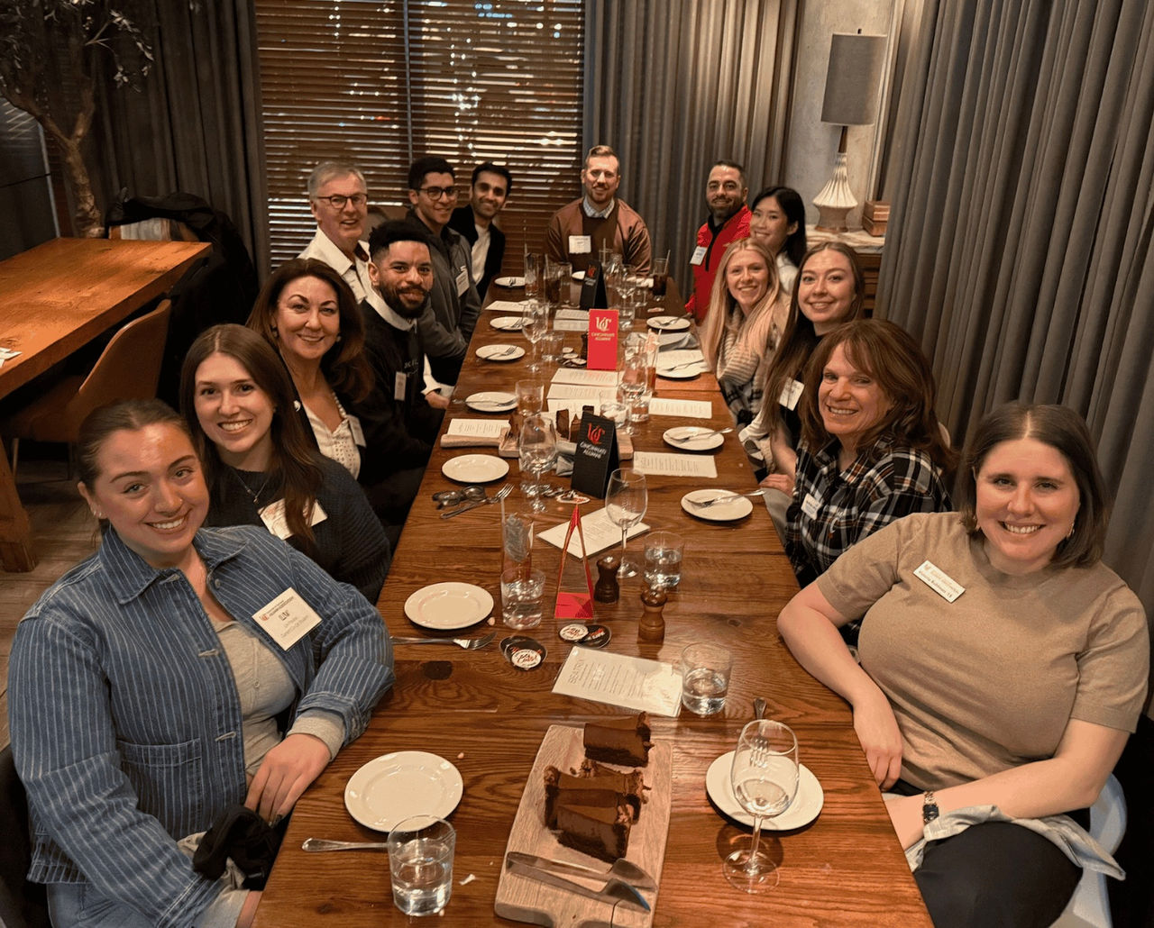 Group of UC students and alumni at Beatrix for Dinner with Bearcats in Chicago. 