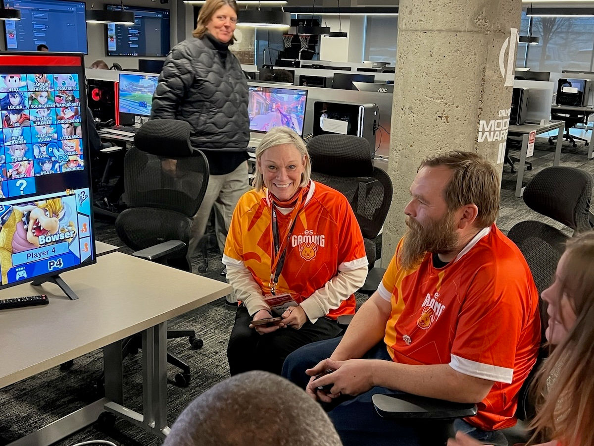 Jackie Reau, CEO Gameday Communications walks by as Debbie Smith of Easterseals Redwood chats with an attendee.