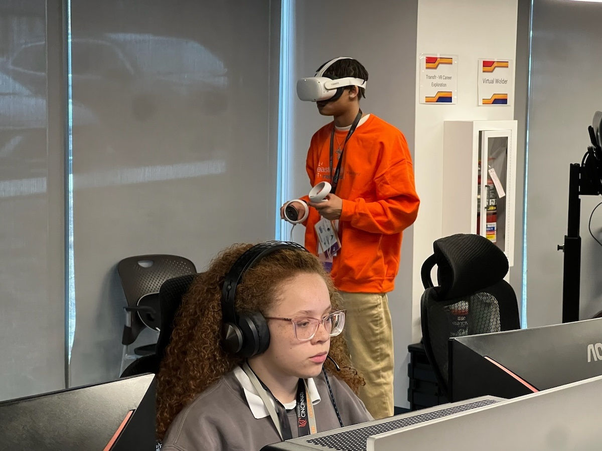 Two students focus on their future possibilities using virtual reality and AI. 