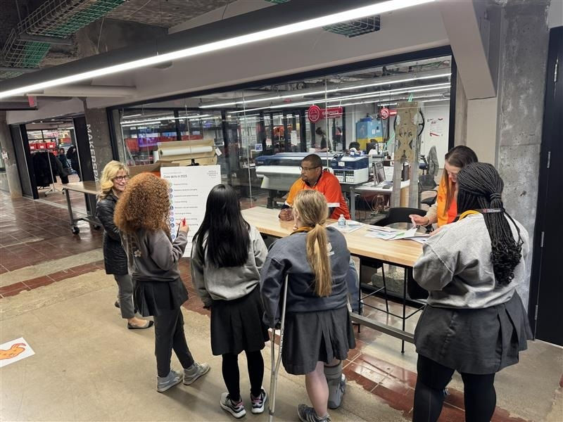  Justin Banks and Christine Mason, Easterseals Redwood staff, speak with students from McAuley High School along with their advisor, Beth Merk. 