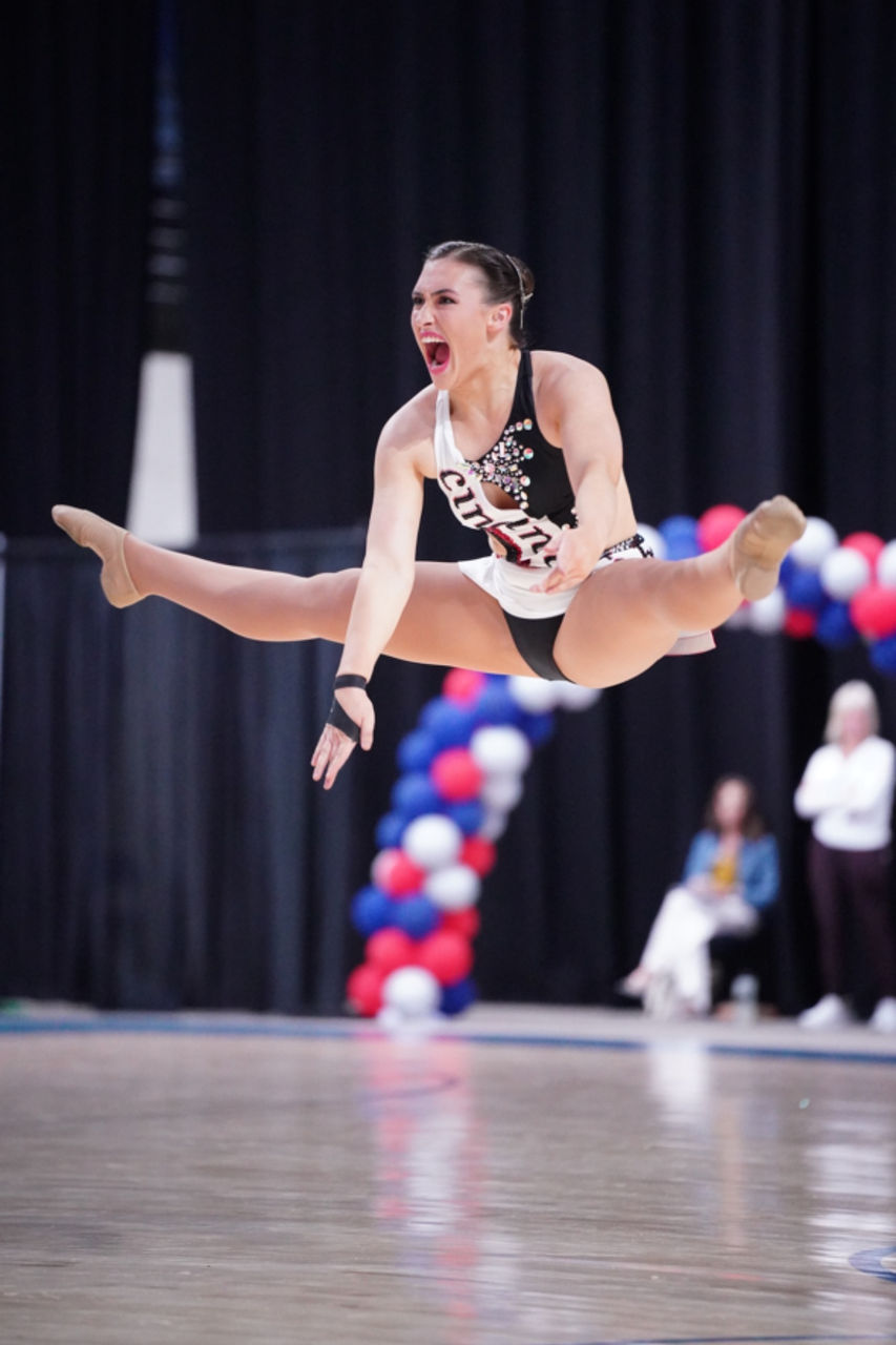 Erienne Hay jumps and does the splits in the air 