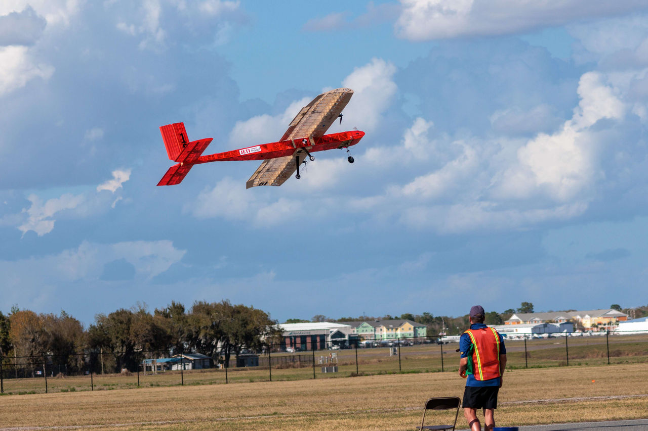 UC Aerocats' plane soaring during SAE Aero Design East