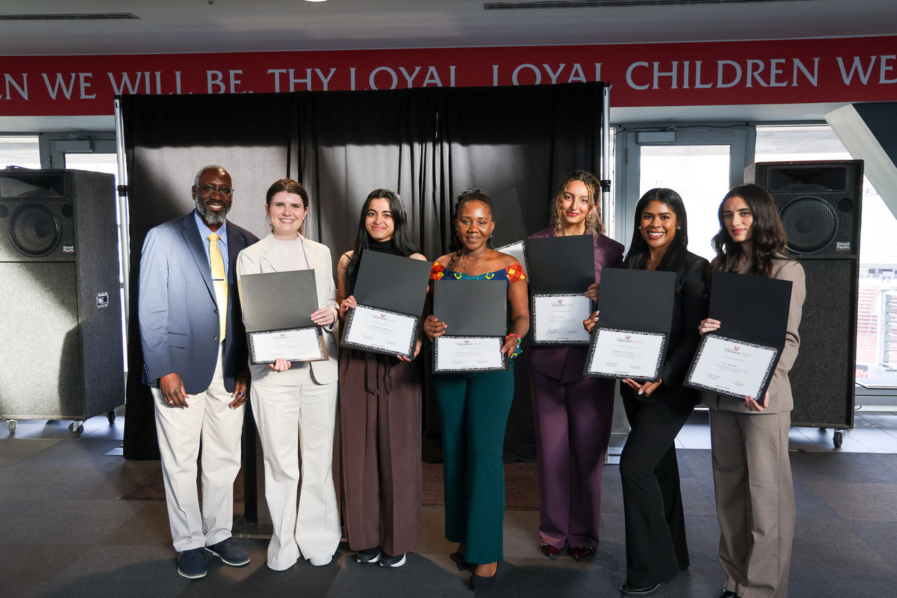 Dean Mack with the winners of the Student Poster Forum